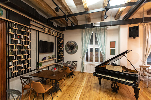 Piano in the middle of wine restaurant without guests