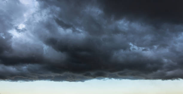 istock Dark cloud with a clear edge of the storm cloud, in front of a thundery front, weather changes 1132073481