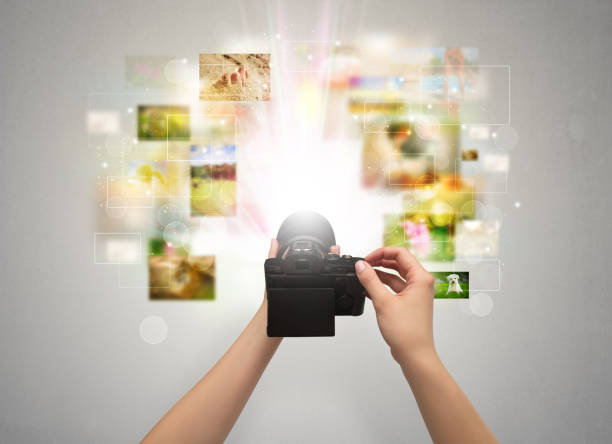 istock Hand captures life events with digital camera 1132073762