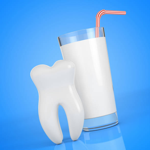 istock White Tooth in front of Glass of Milk. 3d Rendering 1132076042