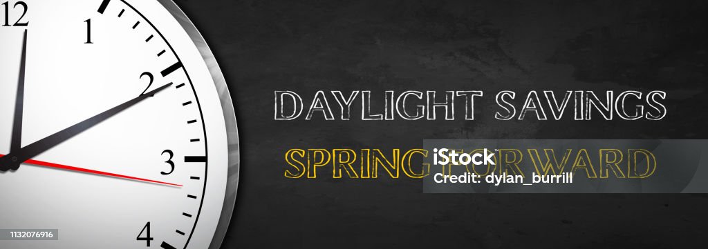 Daylight Savings - Spring Forward Daylight Savings concept with Clock Daylight Saving Time Stock Photo