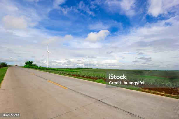 Highway Pineapple Farms In Wind Turbines Stock Photo - Download Image Now - Agricultural Field, Agriculture, Asphalt