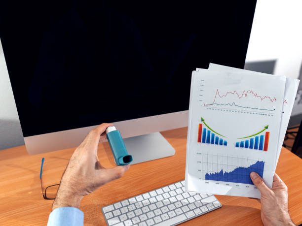 istock Asmatic executive inhaling with an asthma inhaler 1132079616