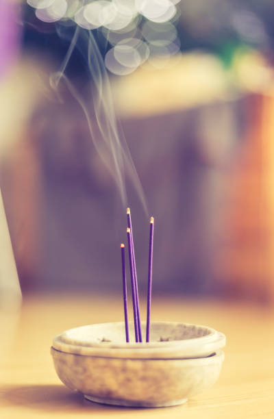 istock Smoking and smelling joss sticks at home, feng shui; Copy space 1132079935