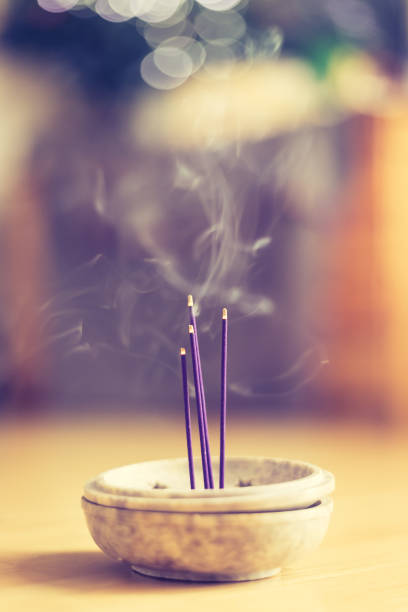 istock Smoking and smelling joss sticks at home, feng shui; Copy space 1132079936