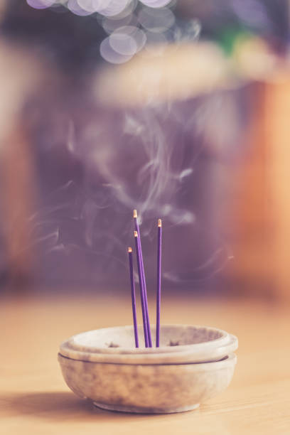 istock Smoking and smelling joss sticks at home, feng shui; Copy space 1132079937