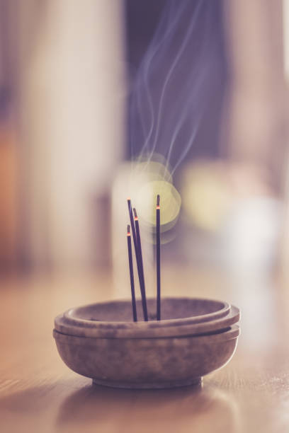 istock Smoking and smelling joss sticks at home, feng shui; Copy space 1132079956