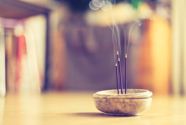 istock Smoking and smelling joss sticks at home, feng shui; Copy space 1132079961