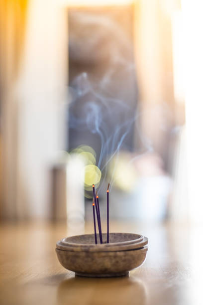 istock Smoking and smelling joss sticks at home, feng shui; Copy space 1132079975
