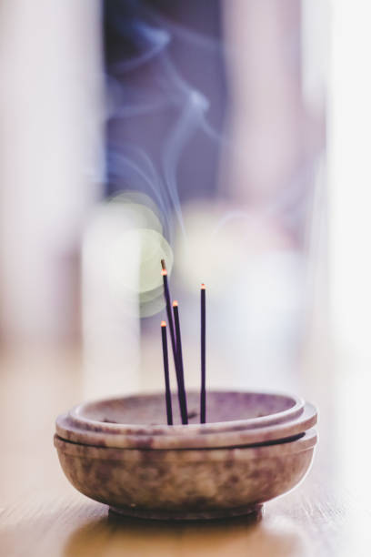 istock Smoking and smelling joss sticks at home, feng shui; Copy space 1132080002