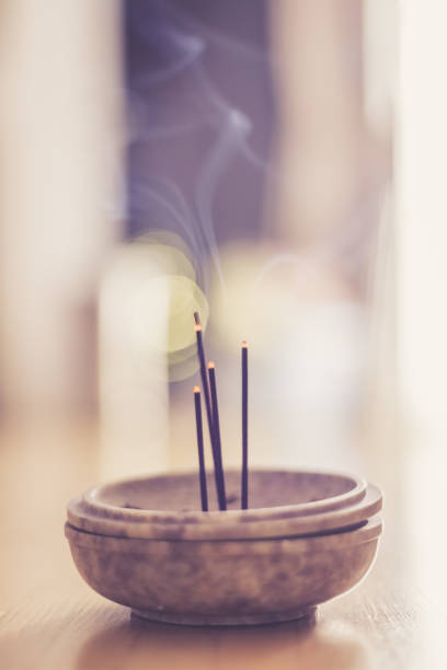 istock Smoking and smelling joss sticks at home, feng shui; Copy space 1132080005