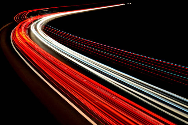istock traffic on the highway at night 1132080188