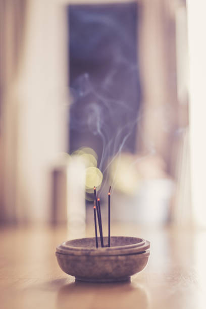 istock Smoking and smelling joss sticks at home, feng shui; Copy space 1132081087
