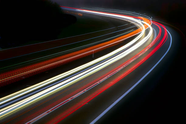 istock traffic on the highway at night 1132083194
