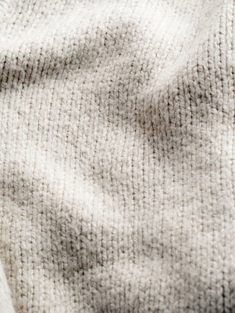 istock cream knitted background,Wool fabric close up texture 1132083326