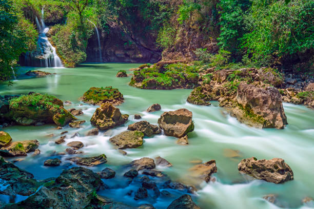 Semuc Champey Waterfall, Guatemala Long exposure of the limestone ridge with cascades and waterfalls of Semuc Champey in the Peten jungle and rainforest of Guatemala. guatemala landscape stock pictures, royalty-free photos & images