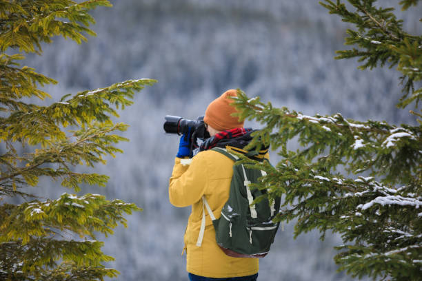 istock The photographer with camera on the cliff 1132083829