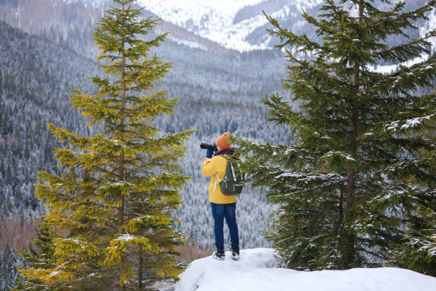 istock The photographer with camera on the cliff 1132083833