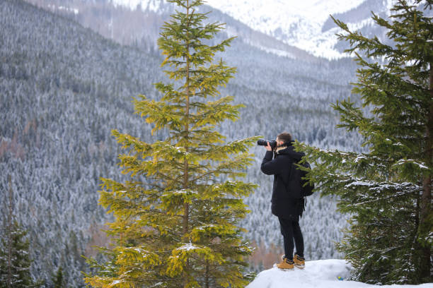 istock The photographer with camera on the cliff 1132084351