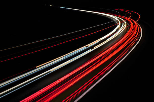 istock traffic on the highway at night 1132084381