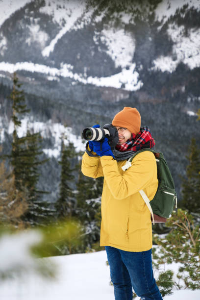 istock The photographer with camera on the cliff 1132084902