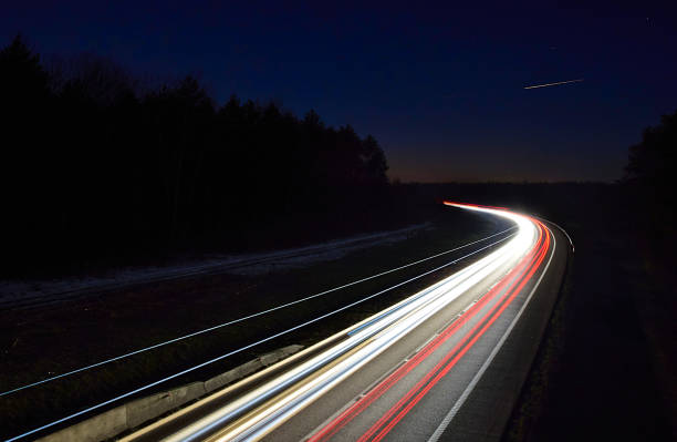 istock traffic on the highway at night 1132086694
