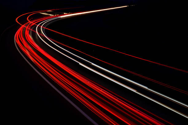 istock traffic on the highway at night 1132086695