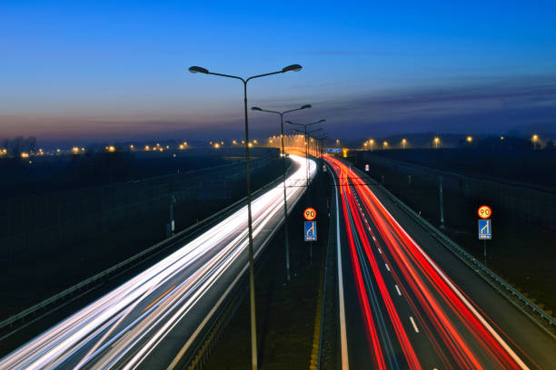 istock traffic on the highway at night 1132086934