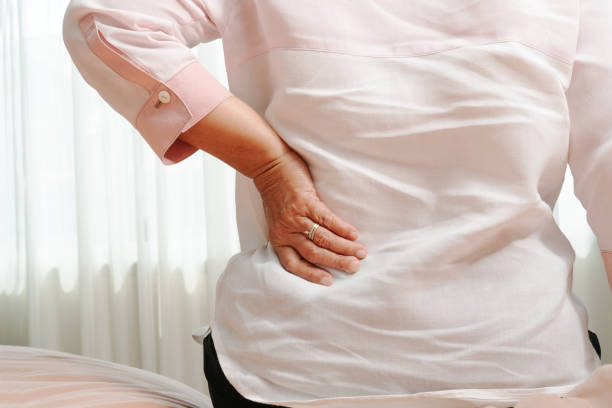 istock Old woman back pain at home, health problem concept 1132087034