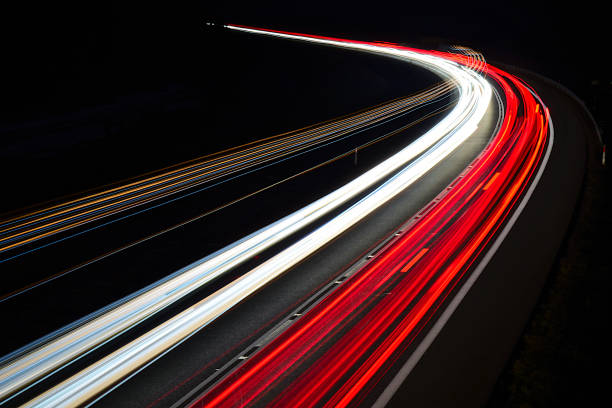 istock traffic on the highway at night 1132088202
