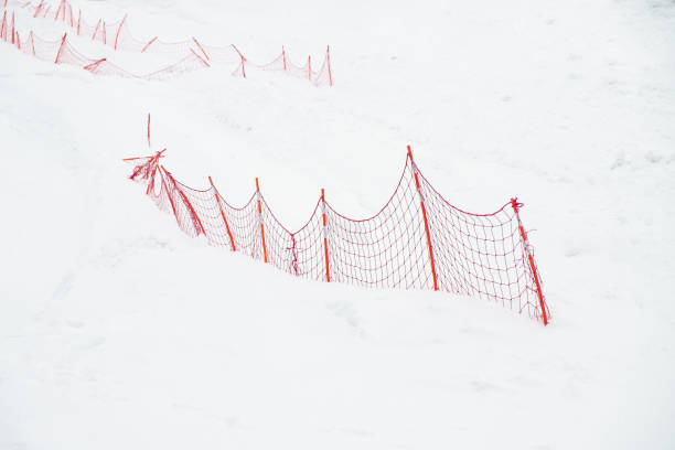 istock Red fence on snow 1132088495