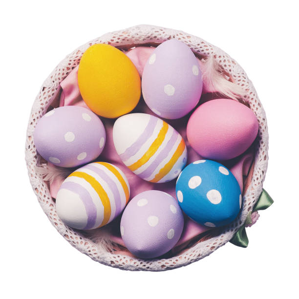 Colorful easter eggs in a plate isolated on white background, top view