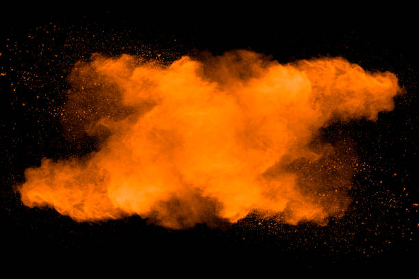 istock Abstract art orange powder on black background. 1132089222