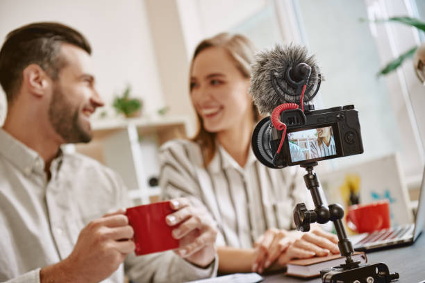 istock Time for a break. Young positive bloggers are drinking tea before starting online streaming 1132090390