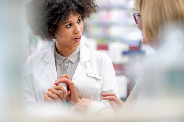 istock Senior woman consulting with pharmacist 1132093438