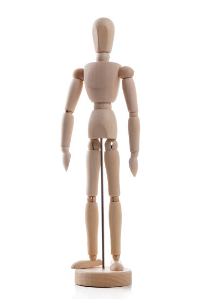 istock Wooden mannequin standing on white background 1132093440