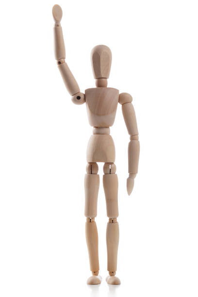 istock Wooden mannequin with one hand raised isolated on white background 1132093463
