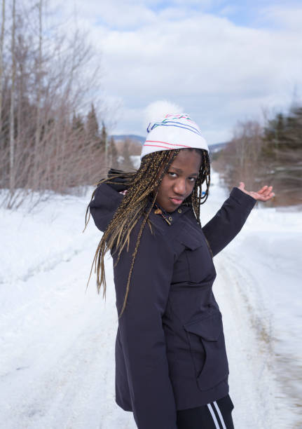 istock Funny Girl Walking in Snow Forest 1132095089