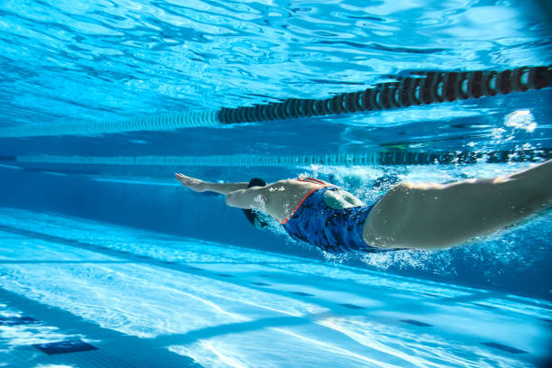 istock Adaptive Athlete diving into the swimming pool. 1132096692
