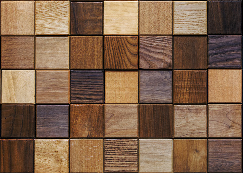 Wood background made of small squares of various color and wood types