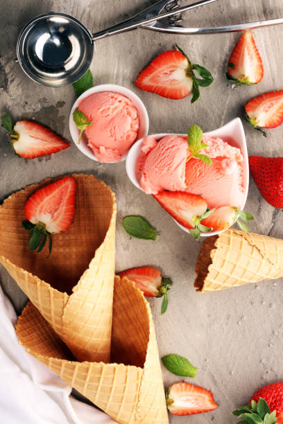 istock Strawberry ice cream scoop with fresh strawberries and icecream cones 1132100541