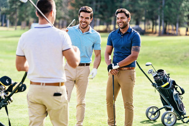 istock Golfers chatting on the playground 1132102547