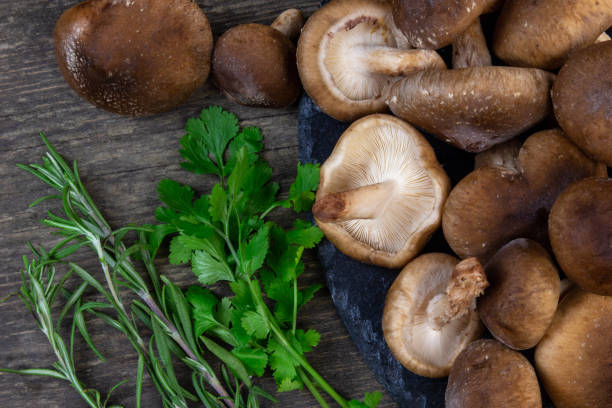 istock shitake mushrooms ready to be cooked with greens 1132104753