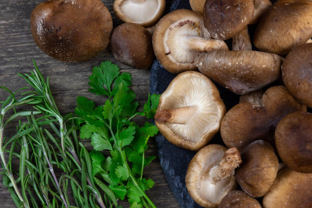 istock shitake mushrooms ready to be cooked with greens 1132104757