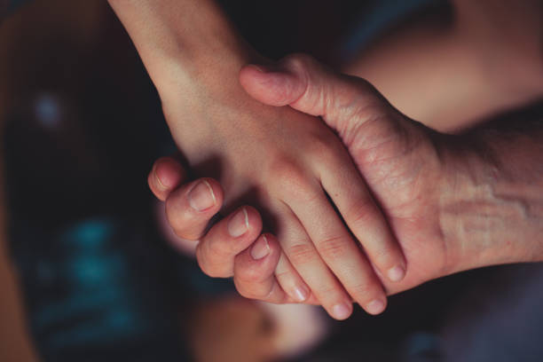 istock Holding hand -  grandson and grandfather 1132104797