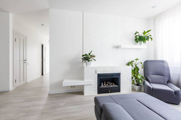 istock Modern living room with fireplace, sofa, balcony and pattern carpet 1132104979