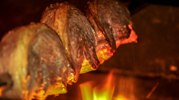 istock meat picanha in fire brazil 1132107109