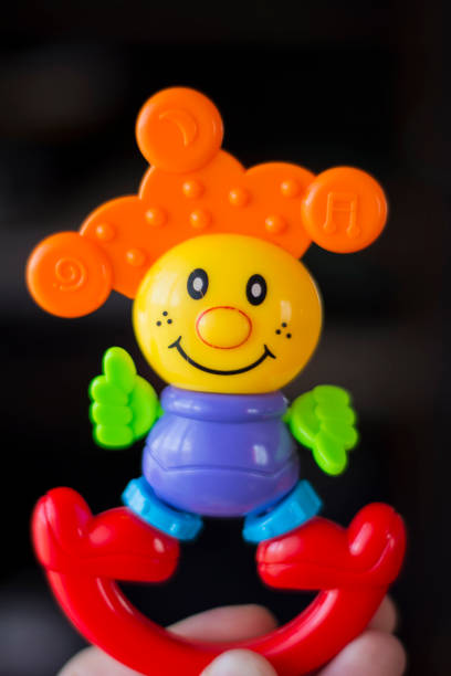 Multicolored plastic toy clown on an isolated background close-up 2018