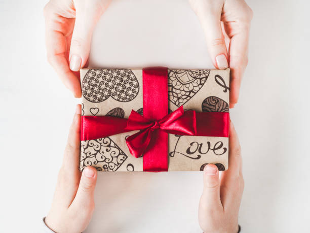 istock Beautiful box with a gift. Congratulations for parents 1132109665