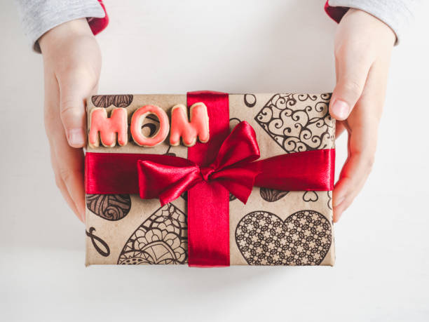istock Children's hands, beautiful box with a gift 1132109712